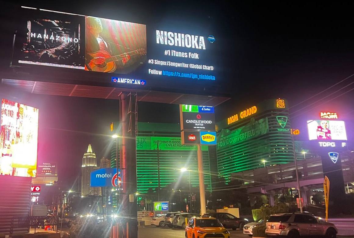 西成在住のシンガーソングライターNISHIOKAさん、米英配信チャートで上位にランクイン！ ラスベガスの巨大ビルボードには楽曲「HANAZONO」の広告が掲出されています