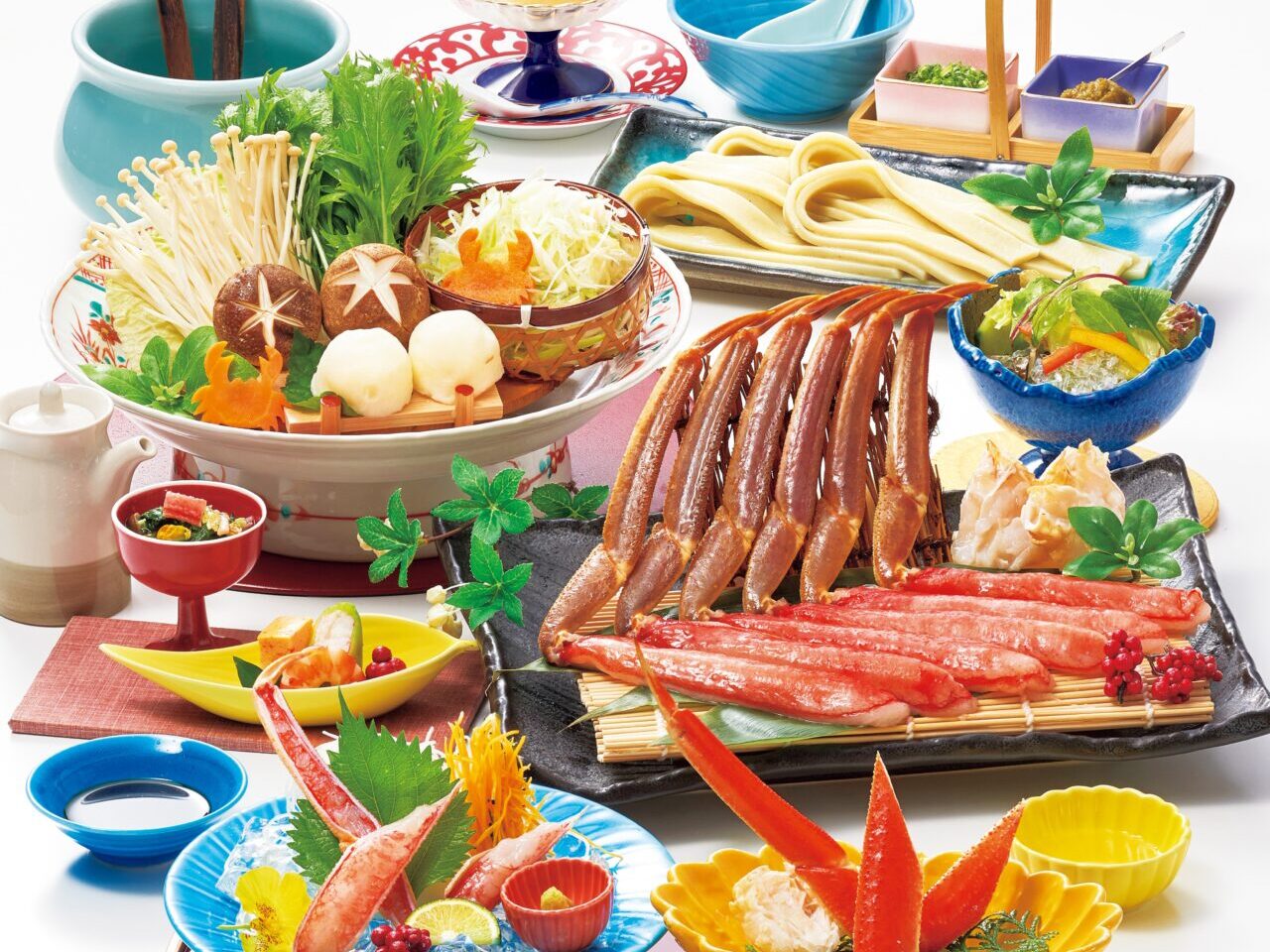 かにしゃぶ会席の料理イメージ。色とりどりの器に蟹料理が並んでいます。
